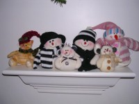 Snowmen on a shelf - and one cat!